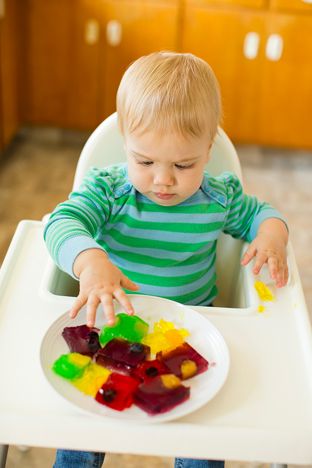 What a fun and easy way to introduce babies to new texture. Who couldn't resist fun jello colors. And hiding fruit in the jello is genius!