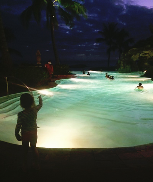 Night swimming in the starlit lagoon at Disney's Aulani Hawaiian Resort